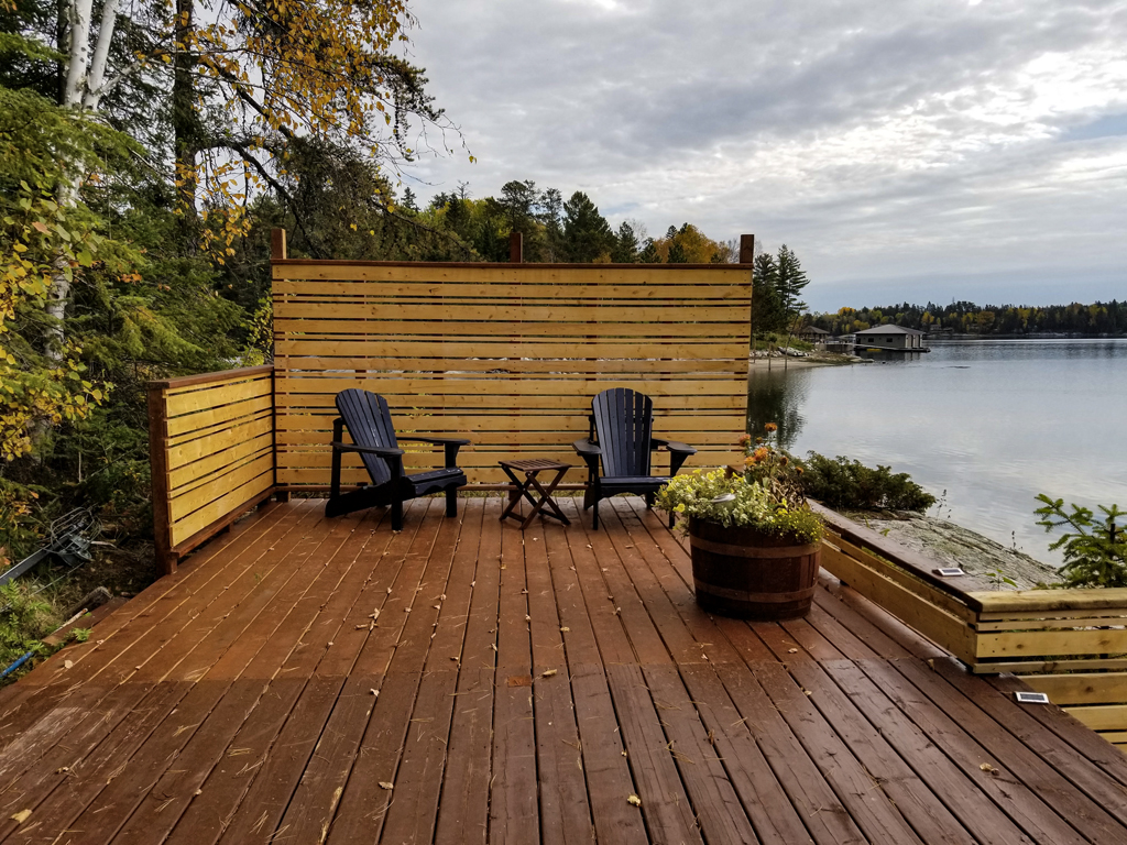 renovation to lakeside outdoor deck adding privacy fense