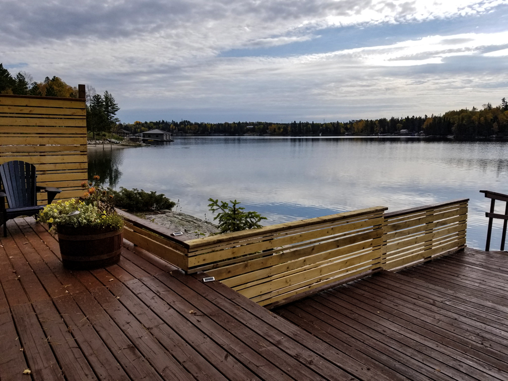 renovation to lakeside outdoor deck adding privacy fense