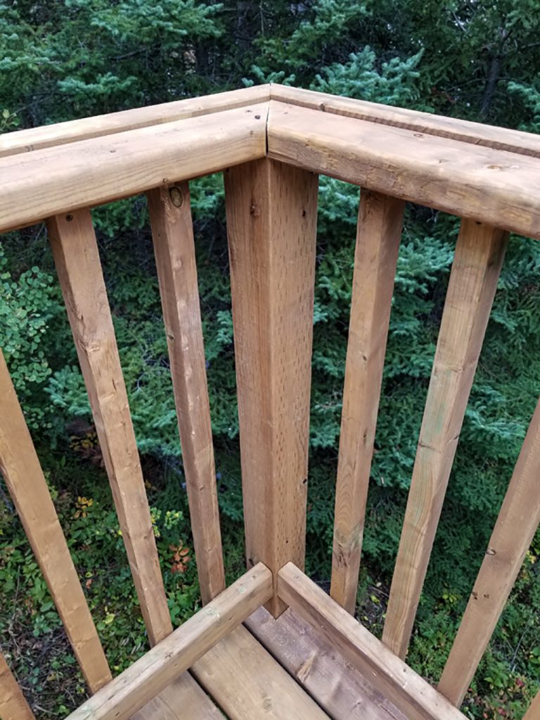 closeup of balusters and railing corner