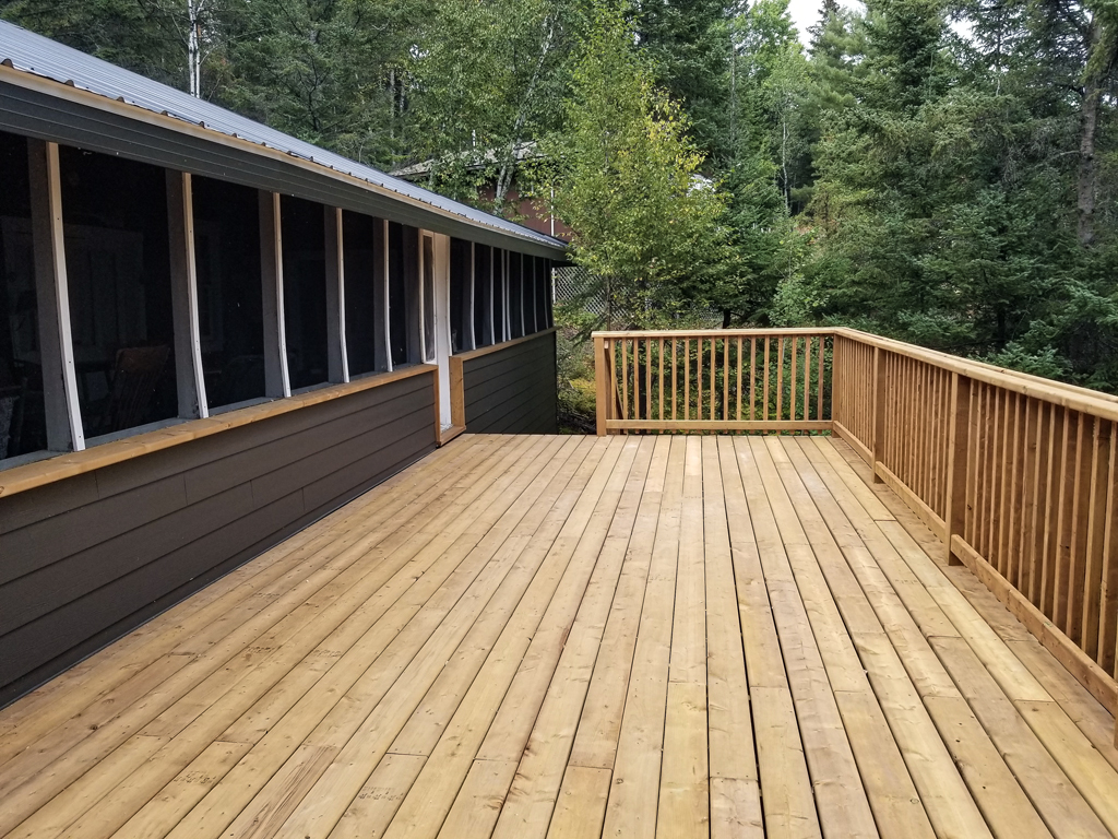 New outdoor deck with balusters and railings