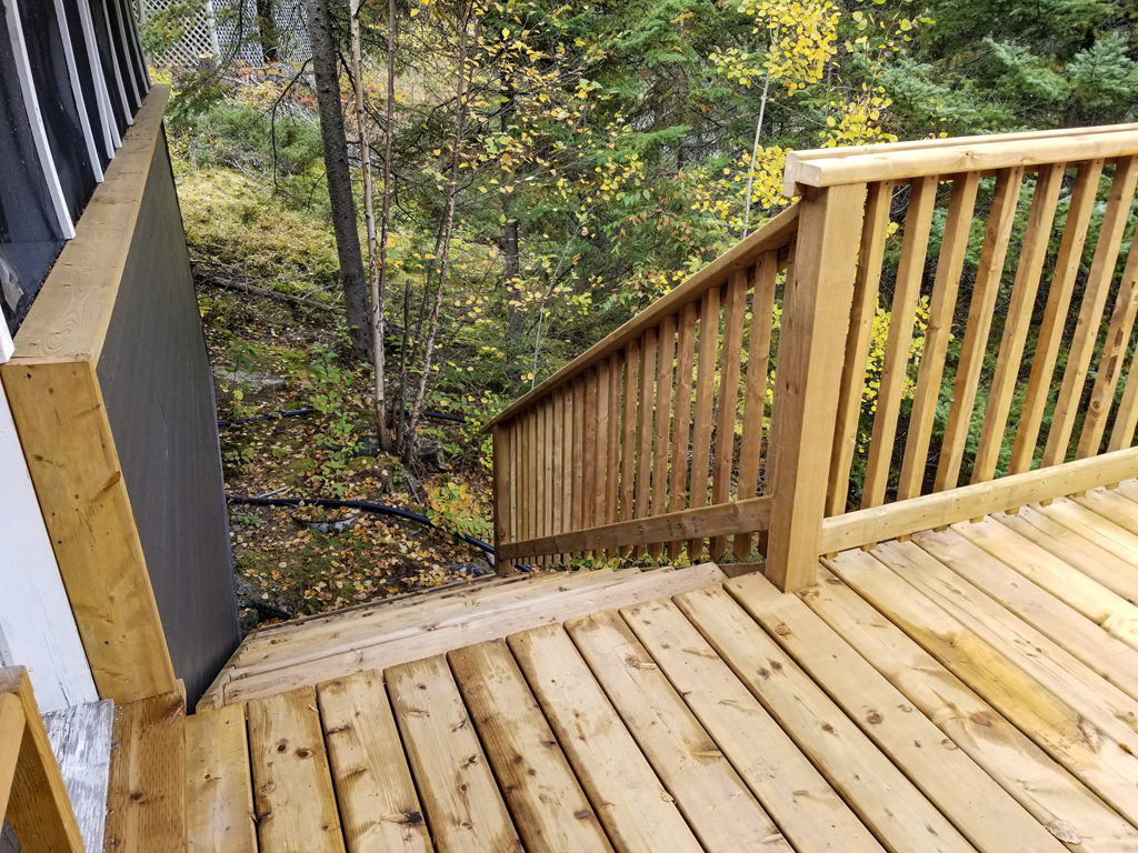 completed outdoor deck with emergency exit staircase