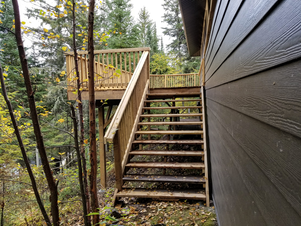 completed outdoor deck with emergency exit staircase