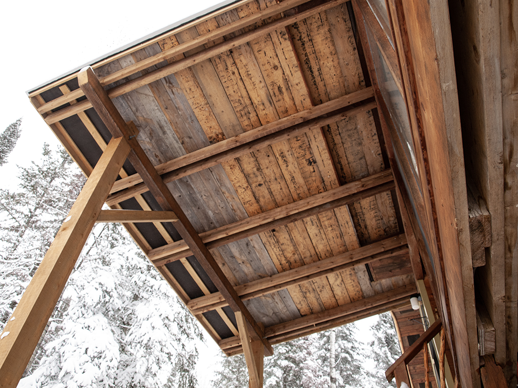 Canopy to shelter front entrance of cottage