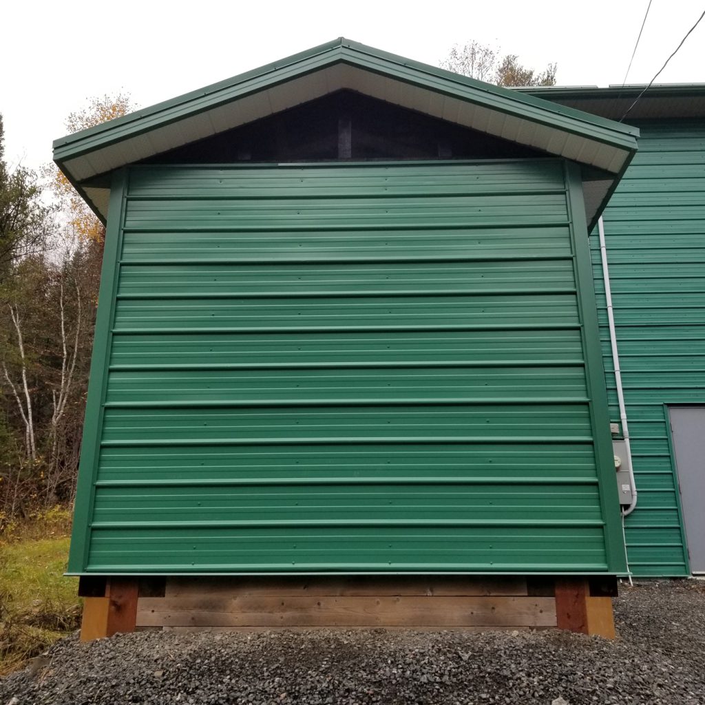 Street side view of finished diesel enclosure