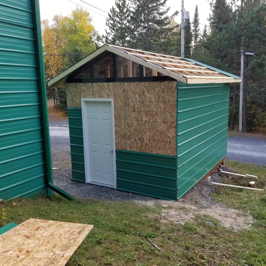 Metal cladding applied to wood shell structure