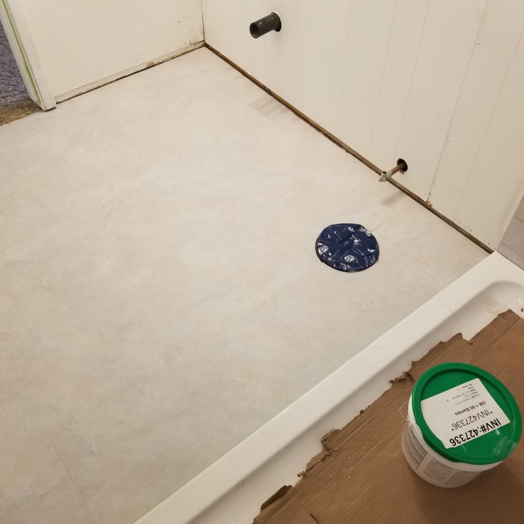 bathroom renovation and plank floor installation
